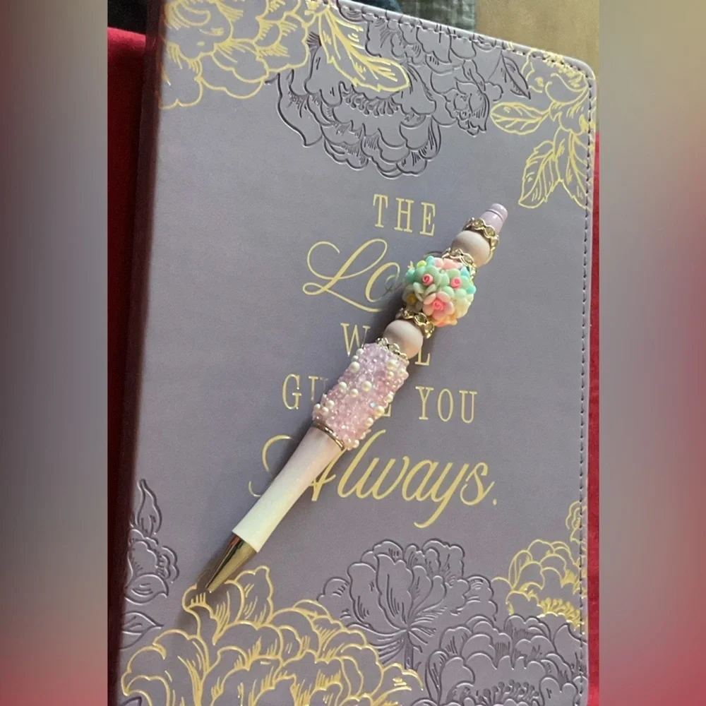 Floral Embossed Purple Journal with Hand Crafted Pen. Journal is 8.5 x 5.75”